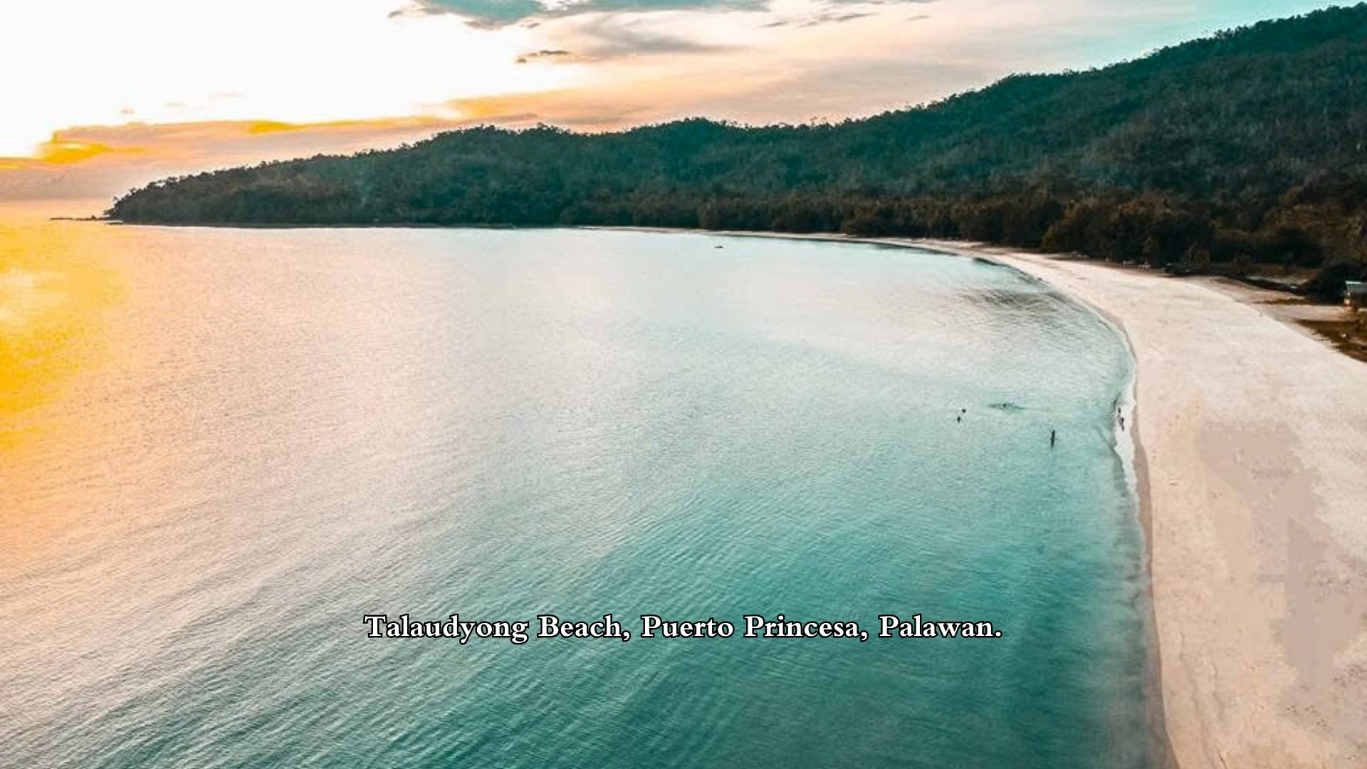 Aerial view of Talaudyong Beach in Puerto Princesa, included in Café Moto Hostel’s Puerto Princesa tours.